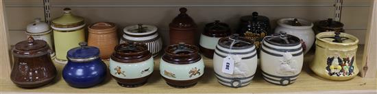 A Royal Winton tobacco jar with moulded decoration and fifteen other tobacco jars, some decorated with hunting scenes (16)